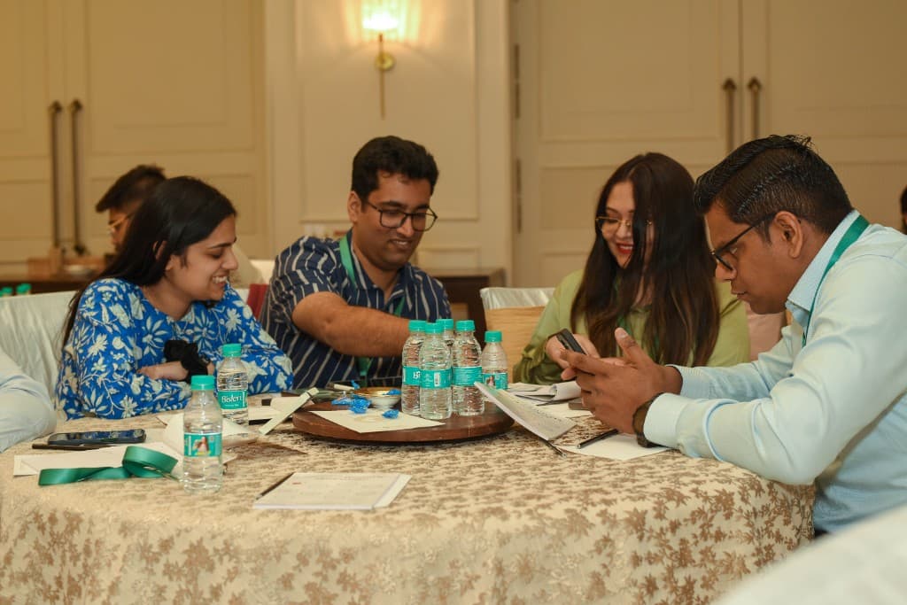 Participants smiling while reviewing card prompts together